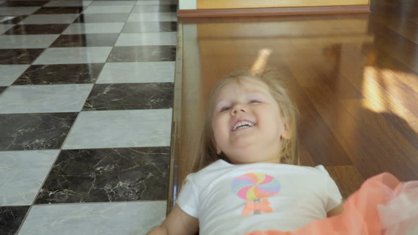 Little girl has fun at home