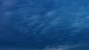Gray rain clouds are moving in the Sky. TimeLapse. Beautiful Cloudscape with Storm Cloudy day in blue sky soar in, dramatic backdrop. Thunderstorm, supercell time. Very danger & angry season.