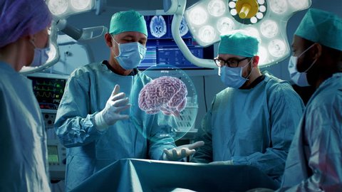 Surgeons Perform Brain Surgery Using Augmented Reality, Animated 3D Brain. High Tech Technologically Advanced Hospital. Futuristic Theme. Shot on RED EPIC-W 8K Helium Cinema Camera.