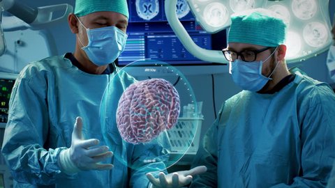 Surgeons Perform Brain Surgery Using Augmented Reality, Animated 3D Brain. High Tech Technologically Advanced Hospital. Futuristic Theme. Shot on RED EPIC-W 8K Helium Cinema Camera.