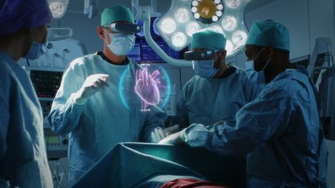 Surgeons Wearing Augmented Reality Glasses Perform Heart Surgery with Help of Animated 3D Heart Model. Doing Difficult Heart Transplant Operation Using Gestures.  Shot on RED EPIC-W 8K Helium Camera.