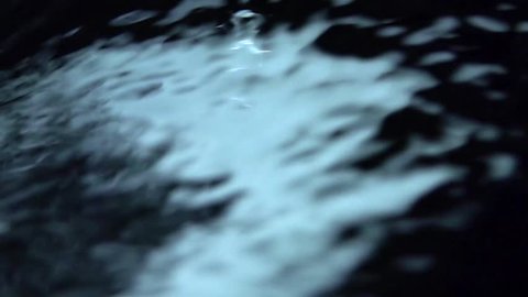 Blue Waterfall on Black Background. Slow motion.