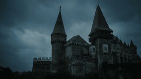 Medieval Castle at twilight with stormy clouds on background.Corvin Castle, Hunedoara, Romania - Powered by Shutterstock - Get 15% off with code: PIKWIZARD15