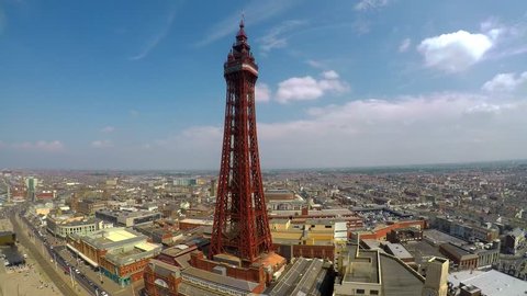 Stunning aerial footage, view of Blackpool Tower by the award winning Blackpool beach, A very popular seaside tourist location in England , United Kingdom, UK