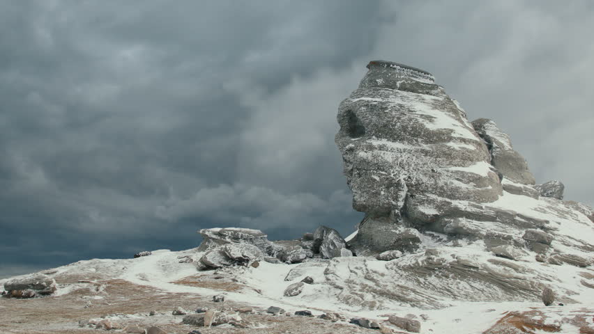 Sphinx rock formation in the Bucegi Mountains during winter