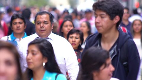 Mexico City, CIRCA June 2018 SLOW MOTION-TAKE 5: Crowd walking through street. In Mexico the population growing is a public problem due the high birth rates.