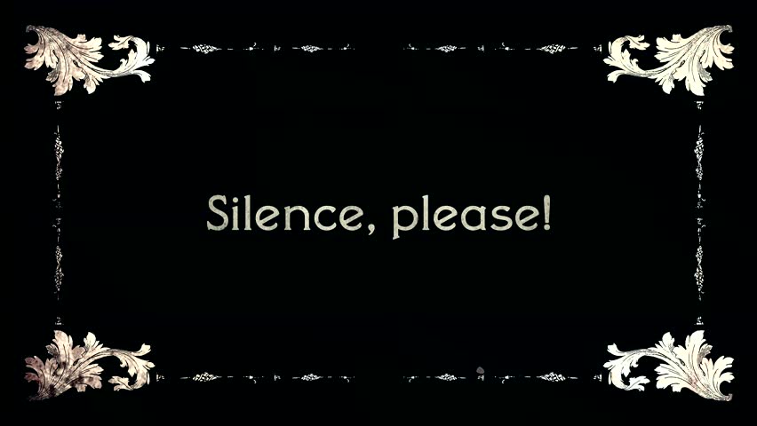 A re-created film frame from the silent movies era, showing intertitle text messages: Silence, Please!
