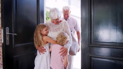 Grandchildren run to greet grandparents as they arrive