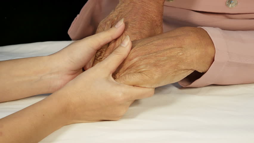 Caregiver, young woman holding hands with the elderly
 | Shutterstock HD Video #1012315469