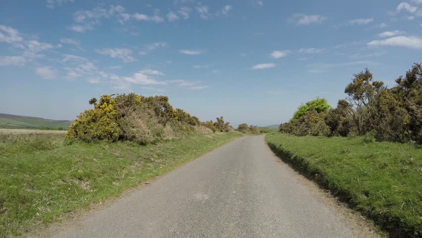 POV driving through Dunkery Beacon hill on Exmoor National Park in Somerset England driving over cattle grid