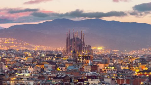 Timelapse aerial view of Barcelona city and sagrada familia skyline at twilight , Spain