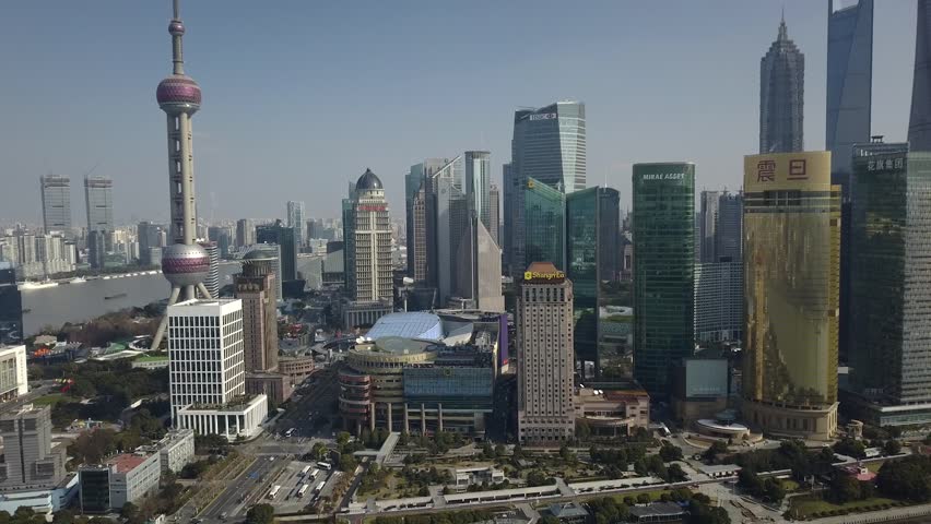 Aerial Side movement Shanghai China Tower Observation Highlights Oriental Pearl skyscrapers Unique Pudong financial district Construction glass energy modern business River embankment. Clear blue sky