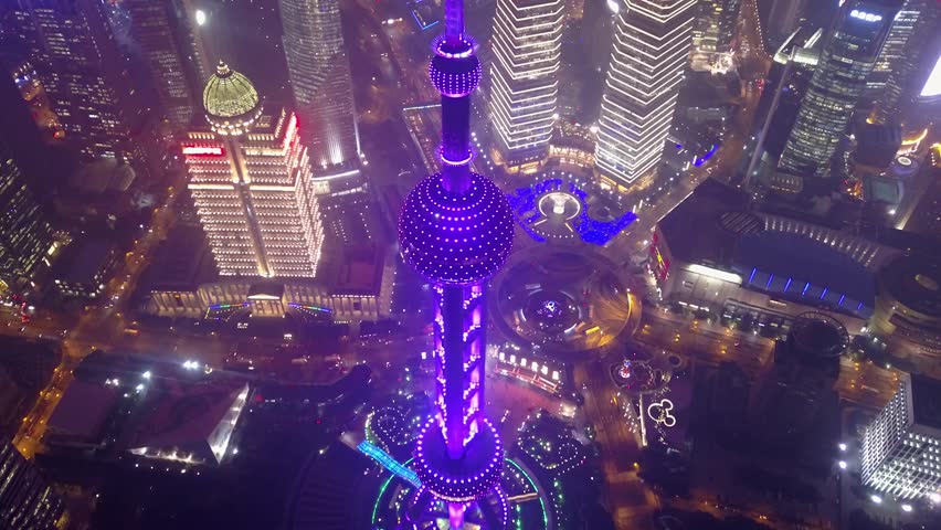 Beautiful Oriental Pearl Tower Night illumination Television Shanghai China bright light modern multicolored urban futuristic skyscrapers Road traffic Pudong bisness. Travel showplace. Helicopter Top