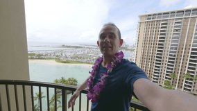 Professional video of young man taking a selfie in Honolulu Hawaii in 4k slow motion 60fps