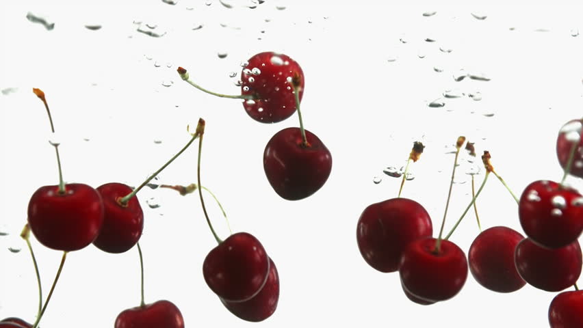 Close up of ripe cherry cherries fall into water on clean white background. Red berries in liquid | Shutterstock HD Video #1012343321