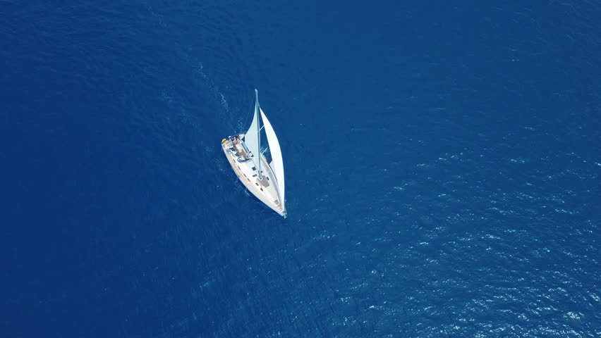 Yacht sailing on opened sea. Sailing boat. Yacht from drone. Yachting video. Yacht from above. Sailboat from drone. Sailing video. Yachting at windy day. Yacht. Sailboat. Royalty-Free Stock Footage #1012346870