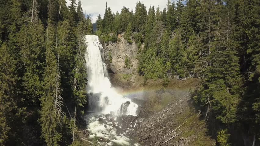 Aerial view of the beautiful waterfall, Alexander Falls, during a sunny summer day. Located near Squamish and Whistler, North of Vancouver, British Columbia, Canada.