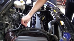Repair engine of passenger car side view. Video full hd.