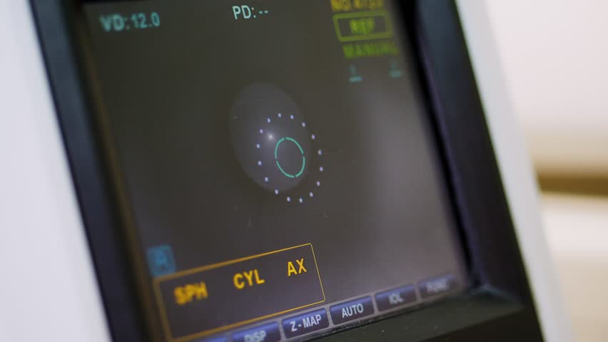 Auto-Ref-Keratometer display with an eye on it. the doctor controls the oculist display with a scanned eye. diagnostic ophthalmologic equipment. medicine concept