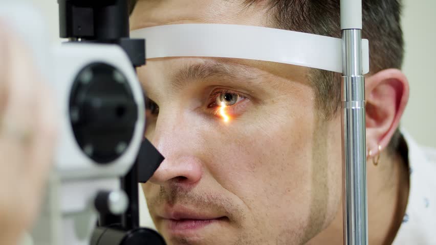 face close-up , man doing eye test with non contact tonometer, cheking vision, intraocular pressure at optical clinic, ophthalmilogical laboratory Royalty-Free Stock Footage #1012370666