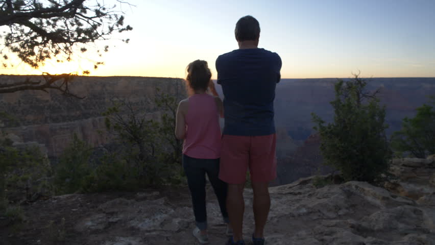 An active mature couple hike near the Grand Canyon