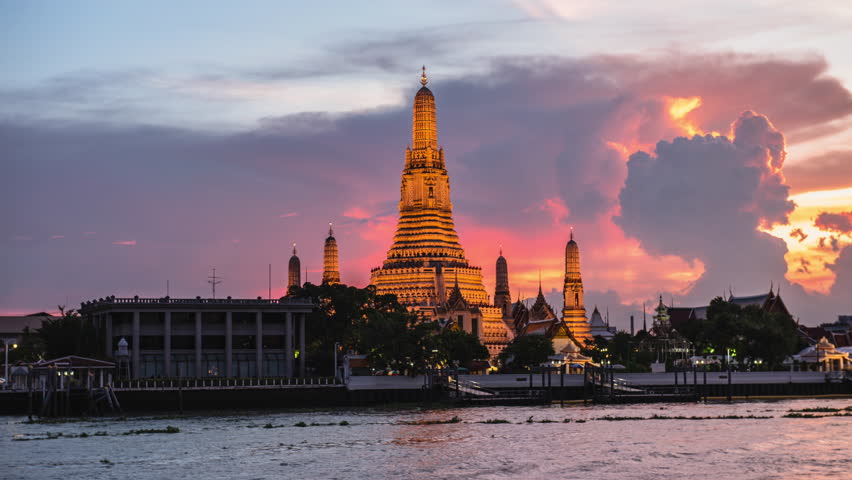Wat Arun or Wat Arun is a temple on the west bank of the Chao Phraya River, Bangkok, Thailand Royalty-Free Stock Footage #1012376348