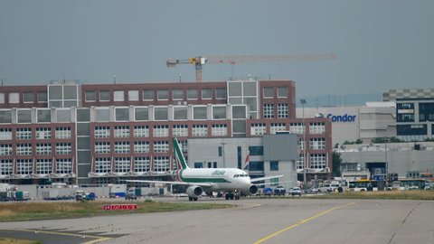 FRANKFURT AM MAIN, GERMANY - JULY 17, 2017: Alitalia Airbus A319 EI-IMD taxiing before departure at runway 18. Fraport, Frankfurt, Germany