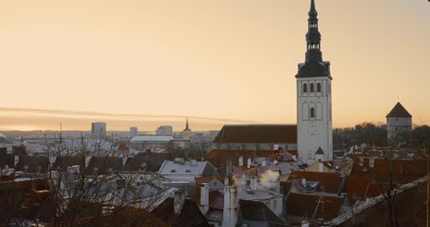 Tallinn, Estonia, Europe. Old Town Cityscape In Morning Sunrise. Popular Place With Famous Landmarks. UNESCO. Pan Panorama.