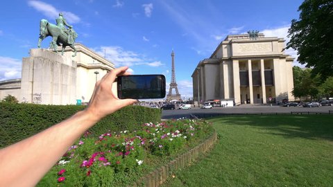 Professional video series of POV taking selfie on Eiffel Tower and Marshal Ferdinand Foch statue in Paris in 4K slow motion 60fps