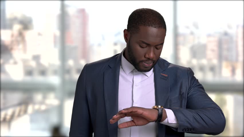 Handsome Afro-american Businessman Checking Time Stock Footage Video (100% Royalty-free) 1012401350 | Shutterstock