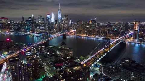 Aerial night view of Manhattan, New York City. Tall buildings. Timelapse dronelapse. NY from above.