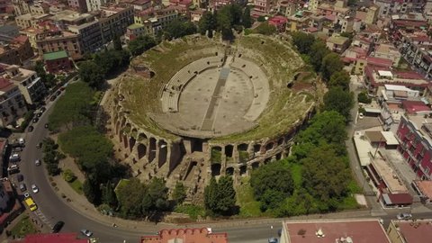 Aerial drone footage of the Flavio Amphitheatre in Pozzuoli, Naples in the south of Italy. 