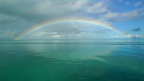 Rainbow on Denawan Island, on motion zoom out