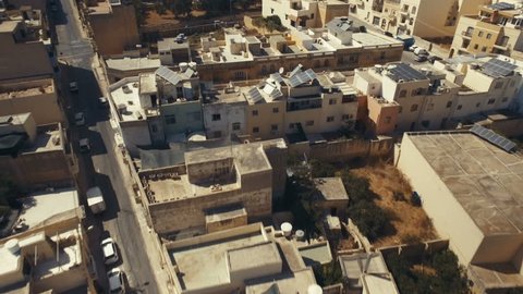 Aerial drone shot flying backwards over Marsaxlokk in Malta