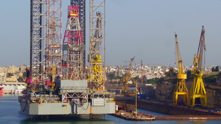 MALTA, La Valletta - May 22, 2018: Offshore oil drill platform in maintenance in Malta, La Valletta; used by the offshore oil and gas industry of hydrocarbons. Royalty-Free Stock Footage #1012410362