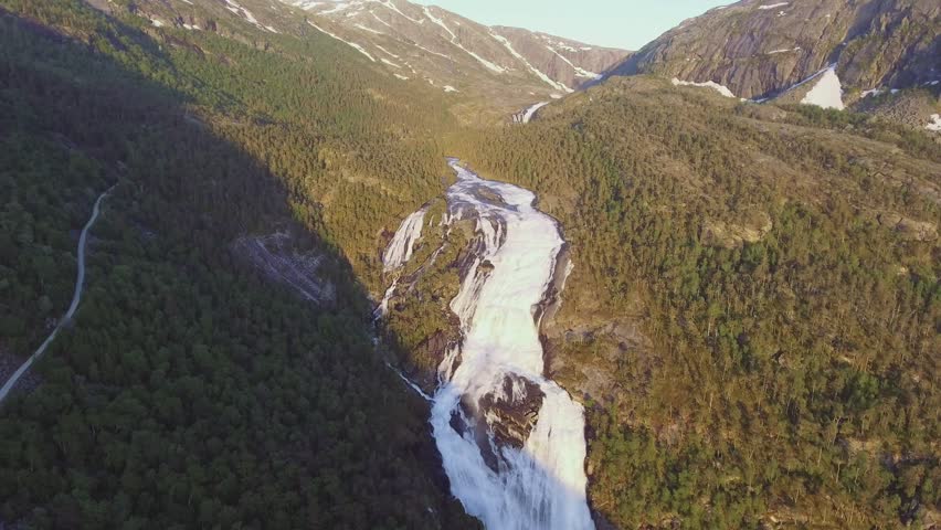 Aerial view of Rapid Stunning Waterfall in Husedalen Valley, Norway. Summer time. Nyastølsfossen
