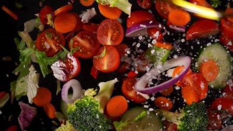 Fresh vegetables frozen in mid-air. Shooted in super slow motion