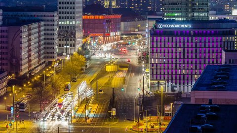 BERLIN, GERMANY - CIRCA MARCH, 2015: Aerial view of Berlin city traffic - cars and pedestrians at evening near Alexanderplatz in Berlin, Germany. Timelapse view 4K.
