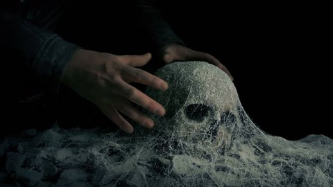 Man Picks Up Skull In Ancient Tomb