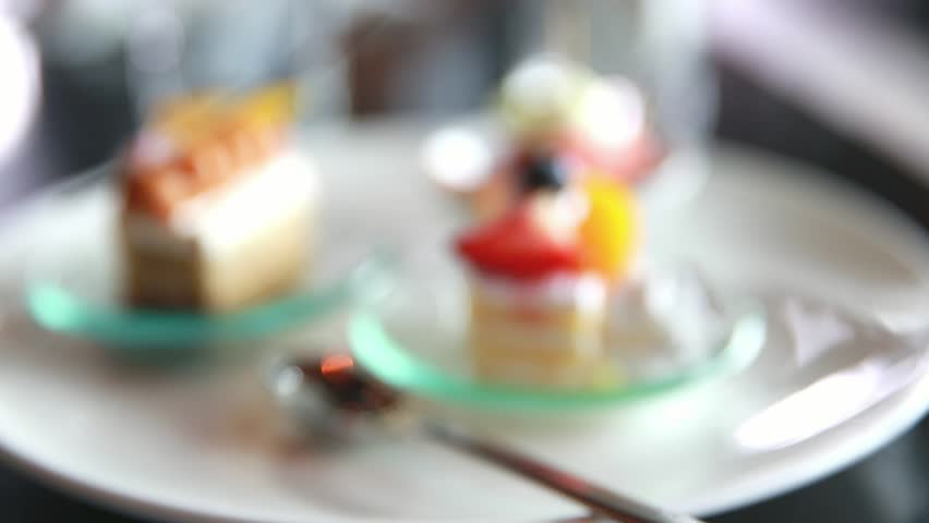 Strawberry and orange fruit cake in restaurant | Shutterstock HD Video #1012419704