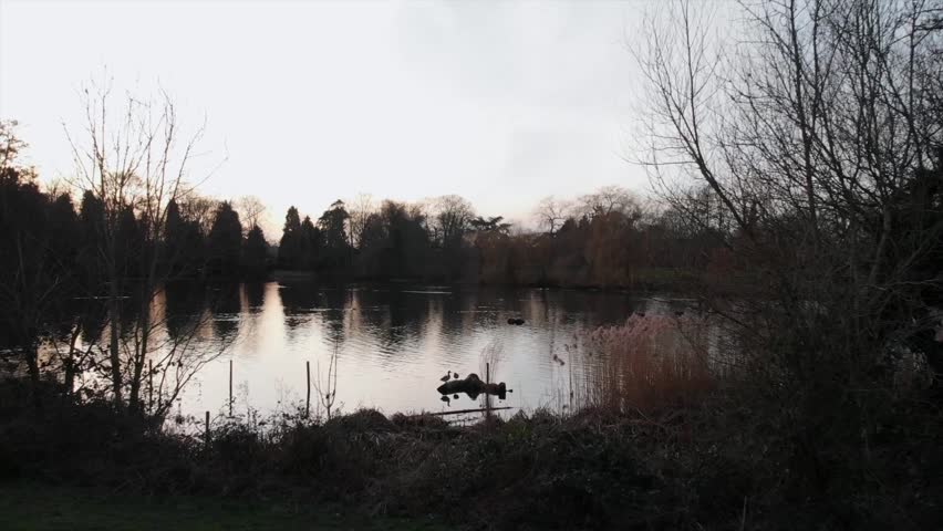 Drone shot over the lake at sunset 