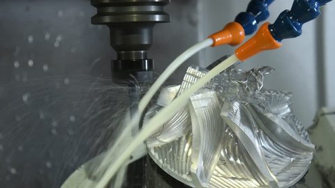 coolant and lubrication. Milling metalworking process. CNC machining by mill.