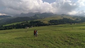 Compaccio, Italy - July 24, 2017: Aerial Drone video of the Sassolungo mountains on the Italian Alps Dolomites