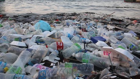 SEMPORNA, MALAYSIA - CIRCA MAY 2018: Plastic pollution environmental problem. Plastic bottles dumped in sea pollute ocean 