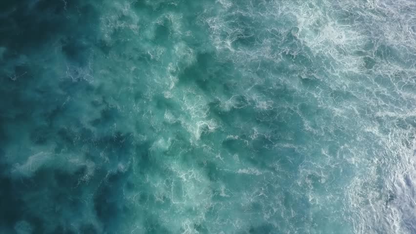 Big Waves rolling from above in Oahu, Hawaii Top down 4k drone view on blue turquoise ocean, breaking waves and whitewash. Sunny day over the sea. Huge swell and foaming on North Shore  Royalty-Free Stock Footage #1012439771
