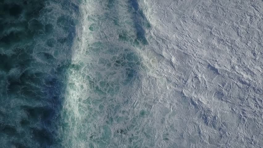 Big Waves rolling from above. Top down 4k drone view on blue turquoise ocean, breaking waves, whitewash. Sunny day over the sea. Huge swell hitting shoreline. Powerful waves Oahu, Hawaii North Shore | Shutterstock HD Video #1012439774