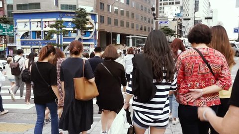 Seoul, South Korea - June 12, 2018 : 
Footage of Tourist and Korean walk in Myeongdong street market at Seoul, South Korea. Myeong Dong district is the most popular shopping market at Seoul city.