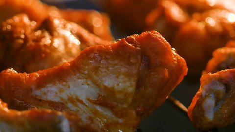 Baking hot and spicy grill chicken wings in the oven with grain processed