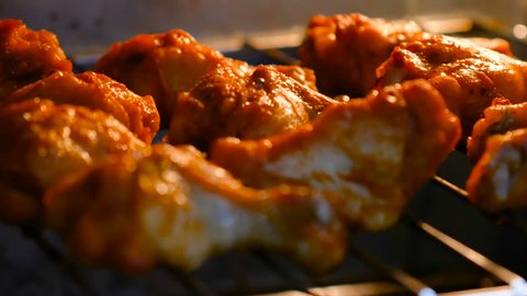 Baking hot and spicy grill chicken wings in the oven with grain processed