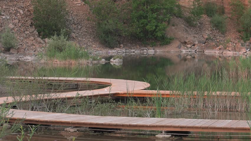 Polish lake. Bridge on the water. rushes in the background.